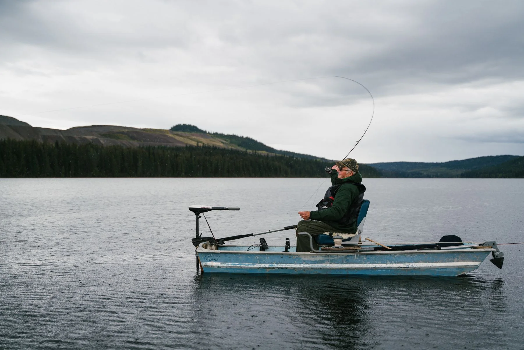 Angler fishing from a small boat